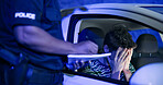 Traffic stop, man and frustrated in car with police, lights and stress for drunk driving or speeding at night. Travel, transport and driver in vehicle with highway patrol, ticket or street compliance