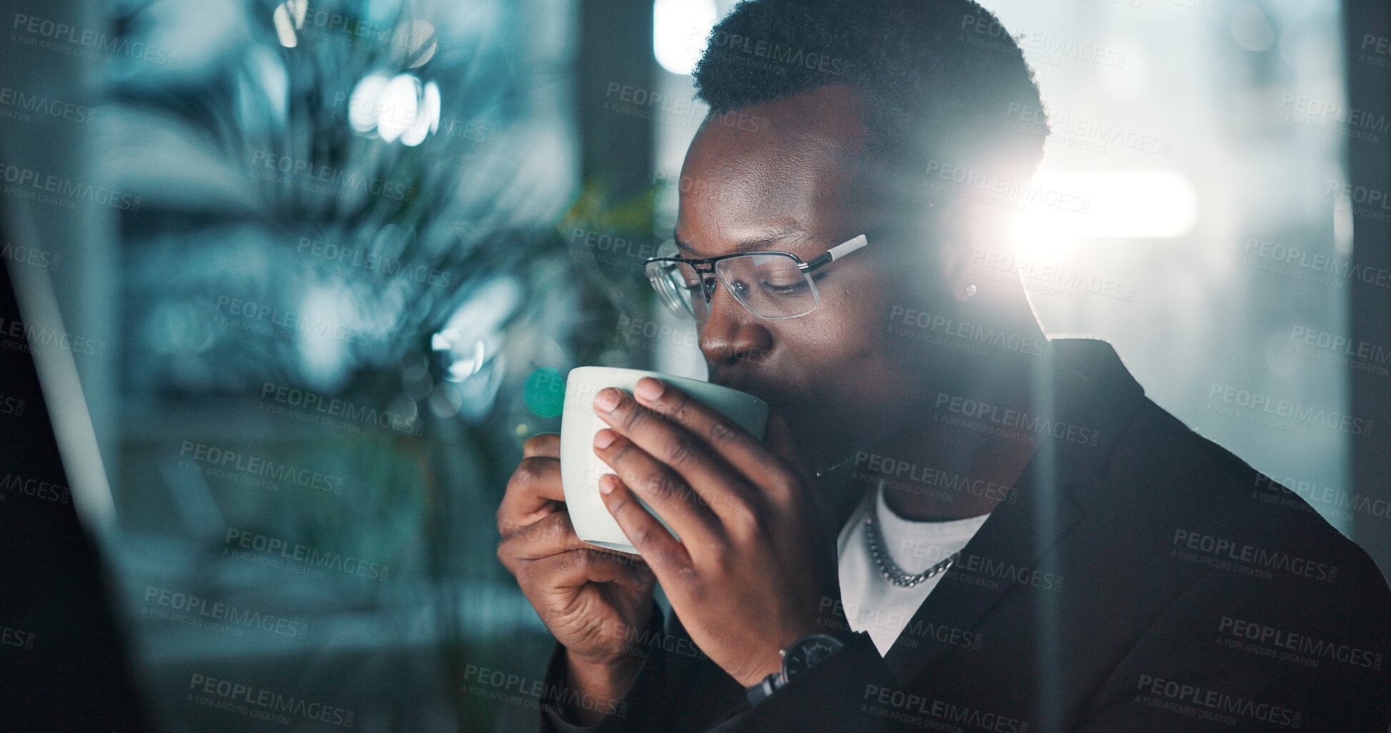 Buy stock photo Black man, drink and coffee in office at night with latte, break and finance proposal deadline. Male accountant, calm and relax with espresso beverage for financial project, working late and overtime