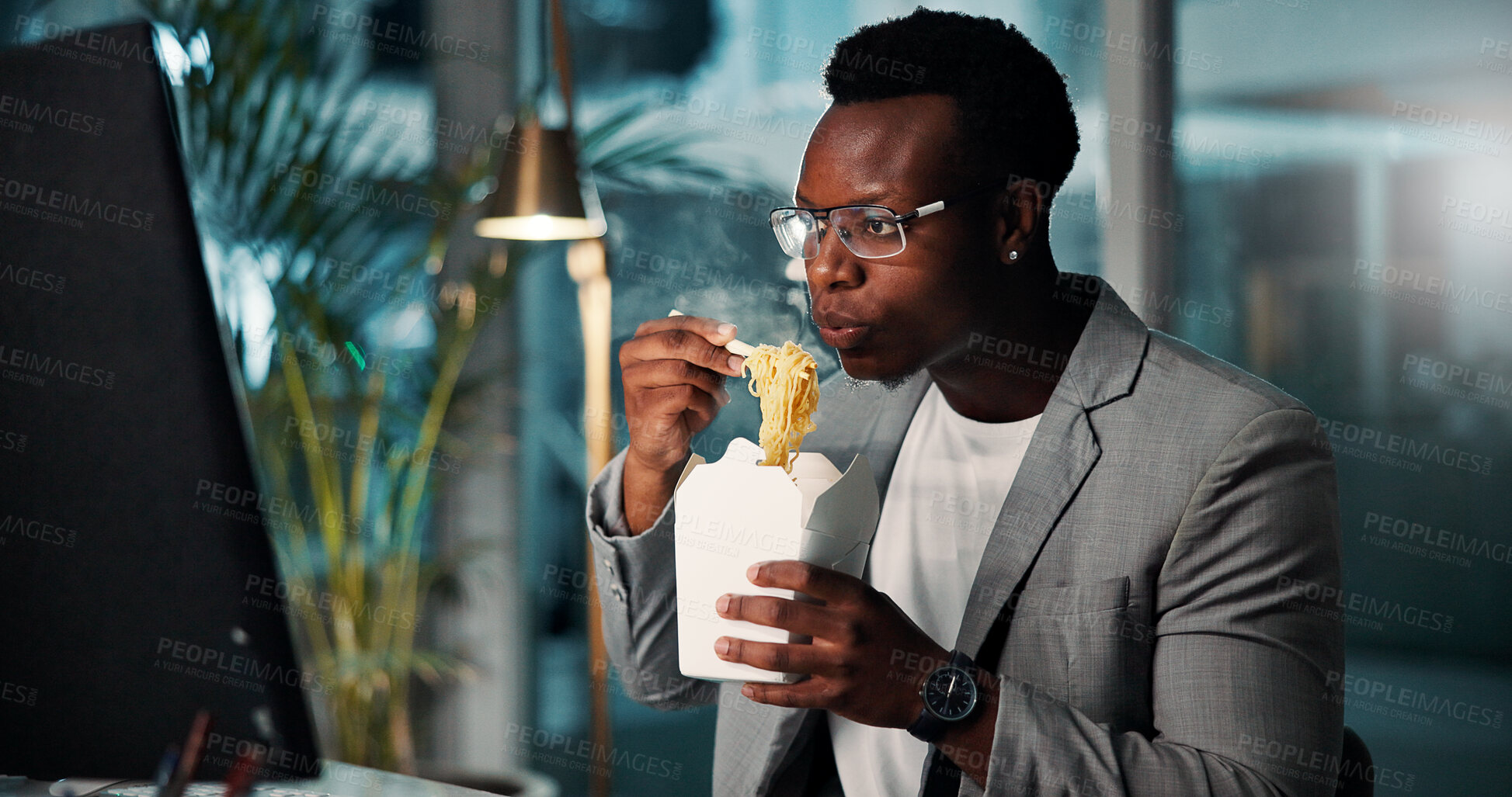 Buy stock photo Business, computer or man with eating fast food in office for working break, publishing deadline and proofreading story. Night, journalist and black person with ramen for overtime dinner and hungry