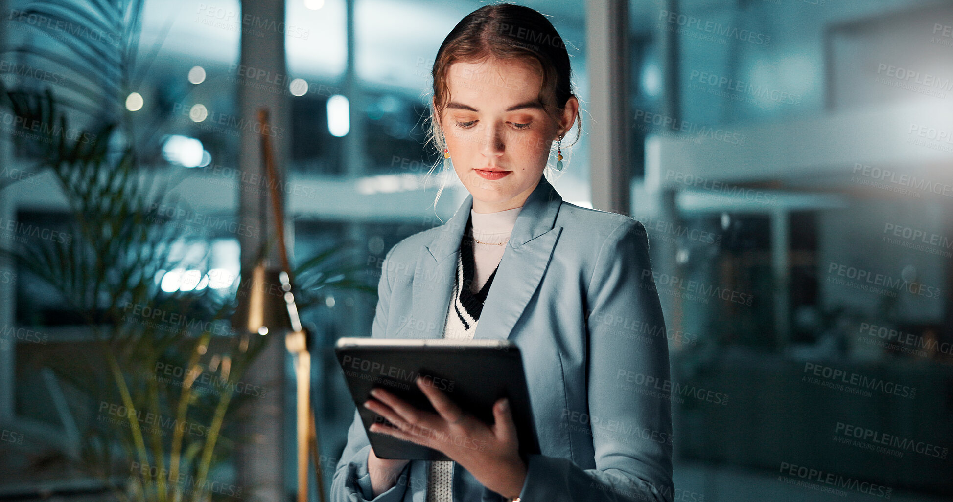 Buy stock photo Night, reading or businessman with tablet, review and news for research and funding approval. Bookkeeping, auditor and female financial advisor in office for accounting deadline and late overtime