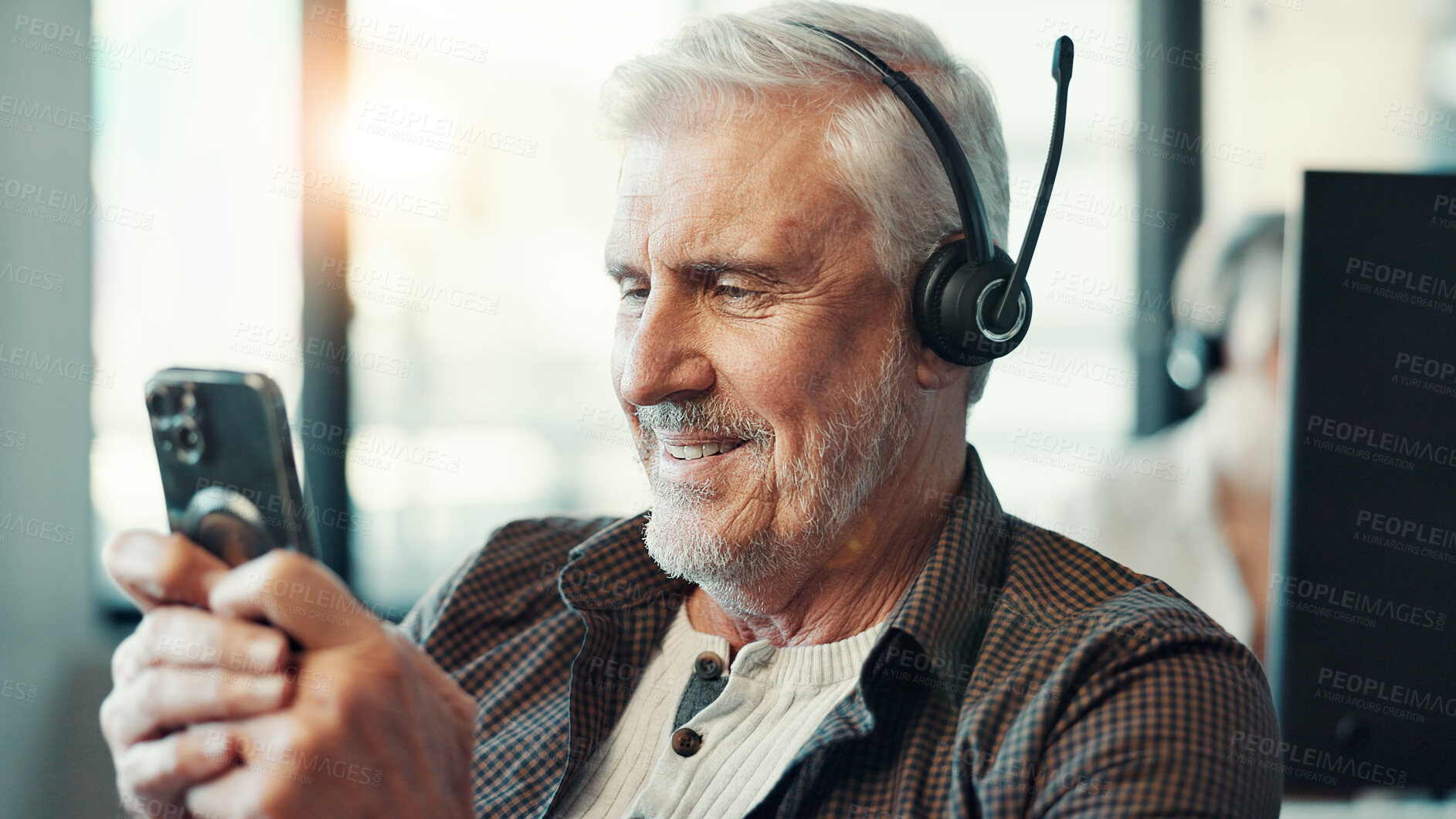 Buy stock photo Call center, headset and man typing with phone for customer service break, text message and mobile chat. Agent, mature person and happy with smartphone for social media scroll and check notifications
