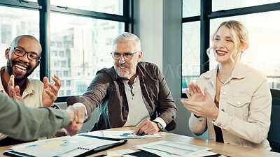 Buy stock photo Man, shaking hands and meeting with applause in office with team, goals and support for deal at startup. Business people, cheers and success with documents, smile and b2b contract at creative agency