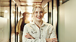 Portrait, arms crossed and woman with smile, office and ambitious for new job, marketing manager and employee. Business, worker and person with happiness for internship, proud and creative agency