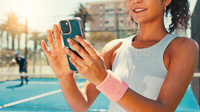 Buy stock photo Tennis, hands and woman on court with phone, social media or scroll on training app for exercise tips. Athlete, smile or mobile on sports ground for blog update, fitness research or club registration