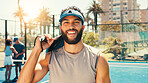 Padel tennis, portrait and man at court for sports, competition training and fitness. Cap, happy player and athlete with racket for practice, exercise and workout for game with confidence outdoor