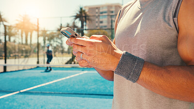 Buy stock photo Tennis, hands and man on court with phone, social media or scroll on training app for exercise tips. Athlete, typing or mobile on sports ground for blog update, fitness research or club registration