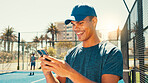 Tennis, happy and man on court with mobile, social media or scroll on training app for tips. Sports coach, phone or excited on turf for club membership growth, fitness progress or tournament results