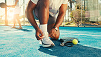 Man, hands and tie shoes for tennis with start, safety and regulation sneakers on court. Padel player, feet and outdoor on turf for tournament, fitness challenge and ready for sports competition