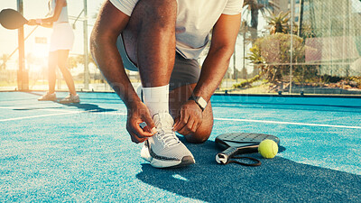 Buy stock photo Man, hands and tie shoes for tennis with start, safety and regulation sneakers on court. Padel player, feet and outdoor on turf for tournament, fitness challenge and ready for sports competition
