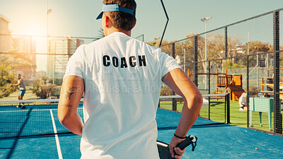 Buy stock photo Back, coach and man with practice, tennis and lesson with fitness, workout and padel. Professional trainer, instructor or athlete with court, training or technique development with wellness or health