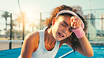 Tennis, tired and woman with fatigue, outdoor and competition with break, contest and sweating. Person, wellness and athlete with fitness, game and exhausted with training, resting and breathing