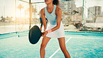 Active, woman and playing with padel racket, outdoor and smile for practice in morning and training. Happy, people and  exercise with ball for game, sports and fitness for performance or wellness