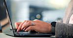 Laptop, hands and businessman typing in office at night for creative project with deadline. Keyboard, computer and closeup of male editor for publishing online with working late at magazine agency.