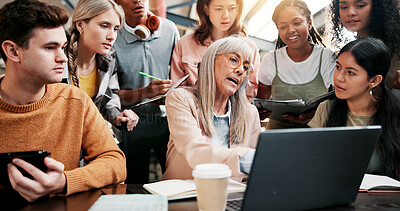 Buy stock photo Education, students and lecturer with laptop, pointing and info for assignment in classroom and group. Knowledge, teacher and mature woman with advice for project, people and discussion in university