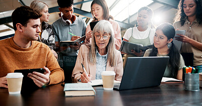 Buy stock photo Education, students and lecturer with notes, explaining and info for assignment with laptop and talking. Knowledge, teacher and mature woman with advice for project, people and planning in university