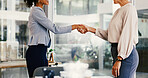 Deal, handshake and partnership with business women in office together for b2b agreement. Meeting, thank you and welcome with employee people shaking hands in professional workplace for collaboration