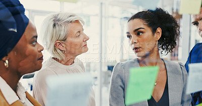 Buy stock photo Collaboration, conversation and glass wall with business people in office for planning or strategy. Agenda, brainstorming and sticky notes with employee team in workplace for discussion or management