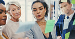 Diversity, glass wall and writing with business people in office for planning or strategy. Brainstorming, collaboration and sticky notes with employee team in workplace for discussion or management
