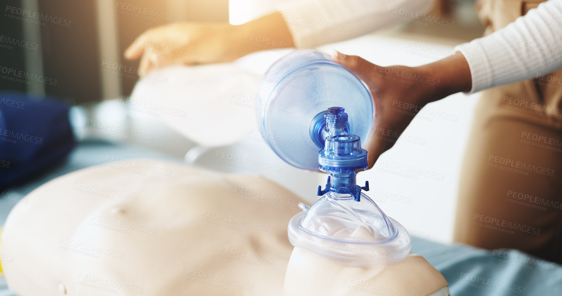 Buy stock photo Oxygen, first aid and hands with mask, class and lesson to help in emergency, dummy and demonstration. Healthcare, person and teaching with ventilator for mannequin, breathing and course for cpr