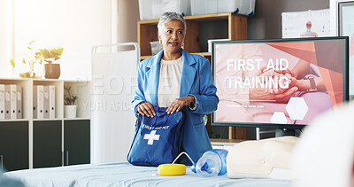 Buy stock photo Woman, teaching and bag for first aid training for rescue safety, demonstration lesson and advice. Person, explain and injury kit for medical emergency, learning procedure and process for life saving