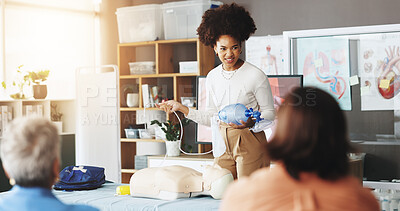 Buy stock photo Healthcare, training and woman with mask, dummy and lesson to help in emergency, cpr and demonstration. Course, people and instructor with ventilator for mannequin, breathing and oxygen in class