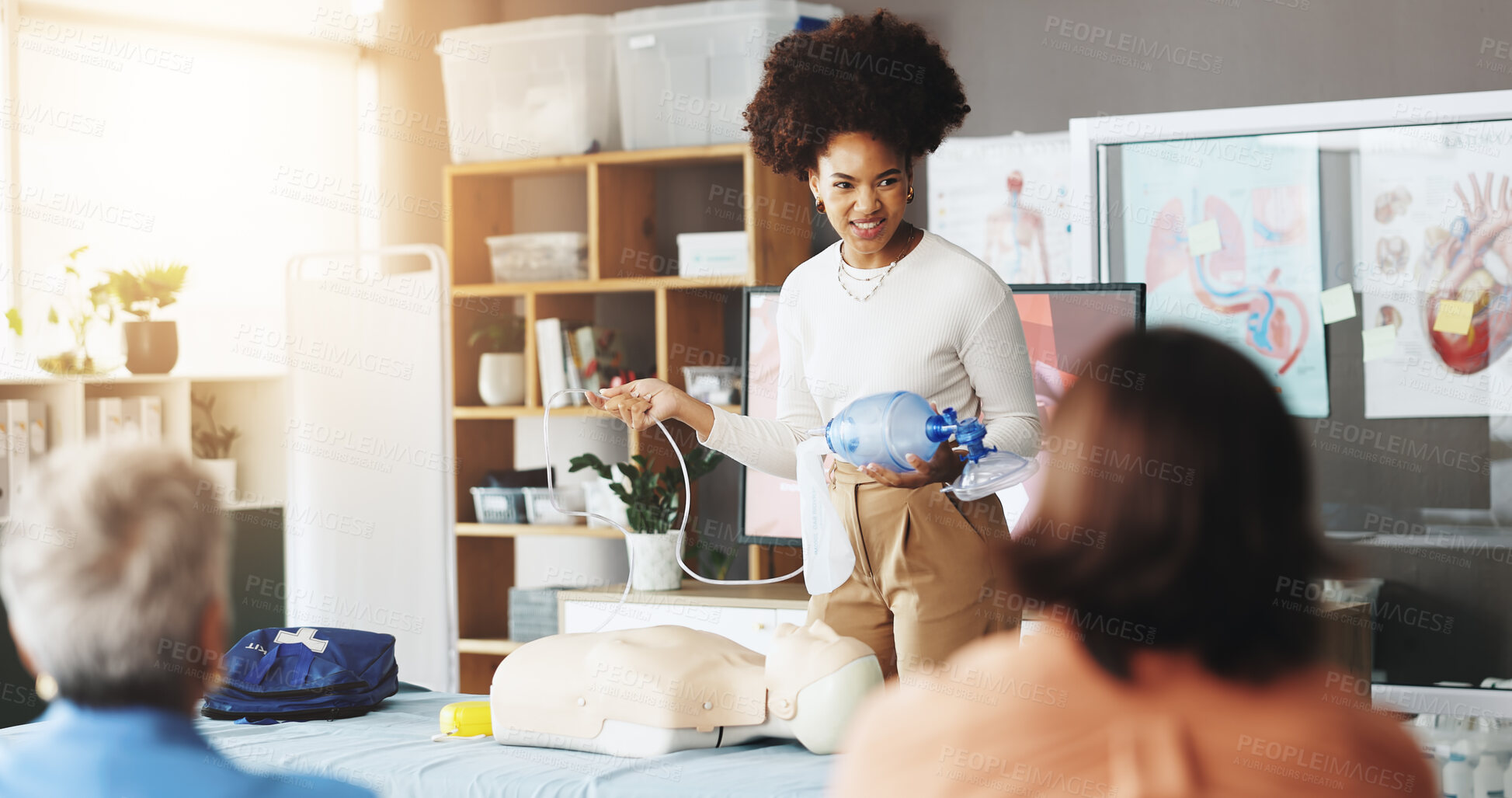 Buy stock photo Healthcare, training and woman with mask, dummy and lesson to help in emergency, cpr and demonstration. Course, people and instructor with ventilator for mannequin, breathing and oxygen in class