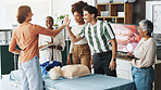 People, teamwork and first aid with high five for rescue, medical training or health and safety at workplace. Happy group, employees or lesson with smile for winning, success or paramedic service