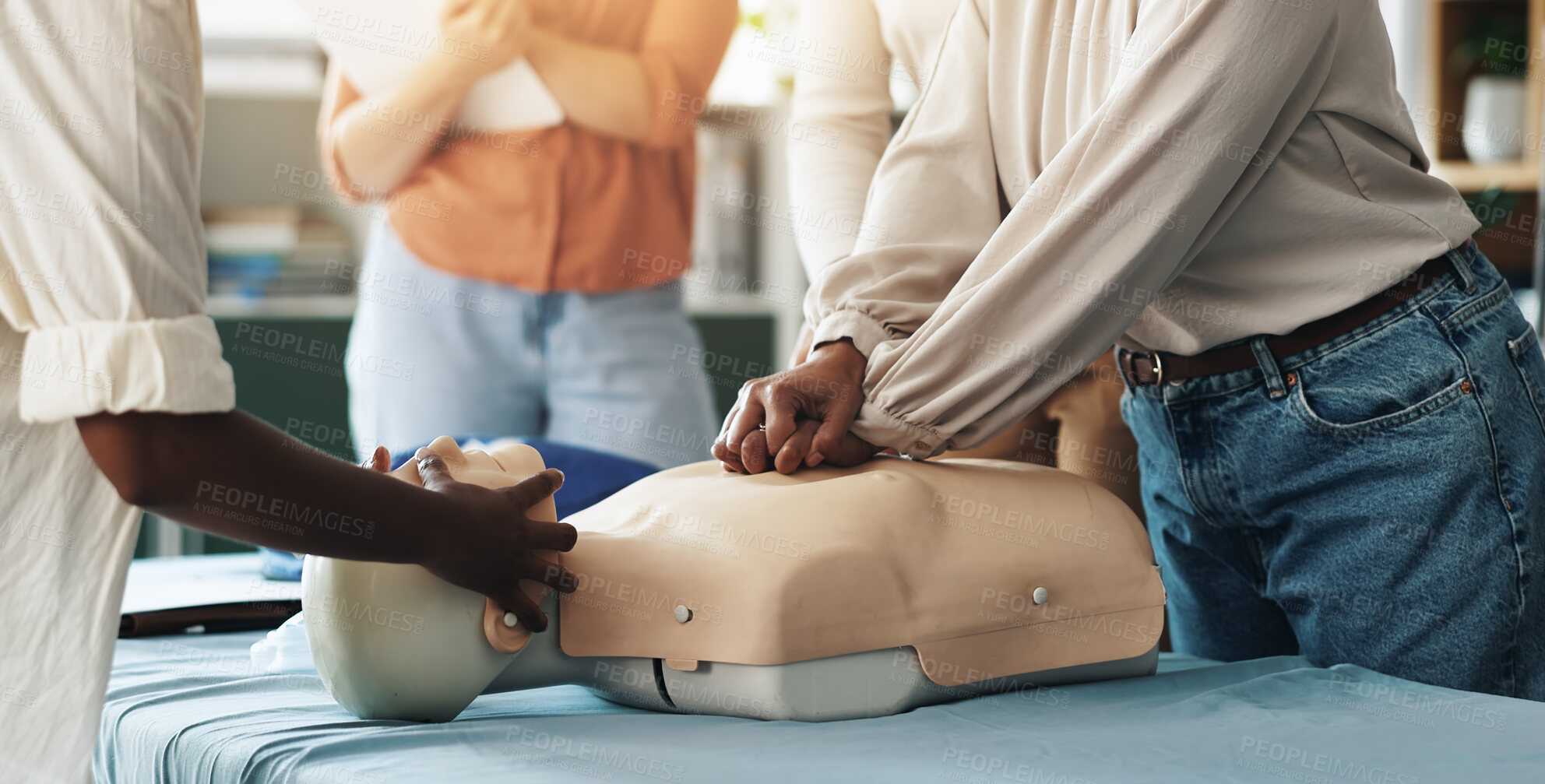 Buy stock photo First aid, training and hands of people with dummy for CPR, chest compression lesson or life saving procedure. Business, teamwork or healthcare class for employee rescue, workplace safety or learning
