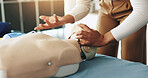 Hands, person and dummy for first aid training with demonstration, breathing safety and rescue. Woman, explain and mannequin for choking procedure, emergency process and learning position for urgency