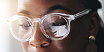 Eyes, reflection and black woman with glasses, reading and research for data analysis, sales and company. Business, eyecare and review of graphs on web, scroll and person with prescription eyewear