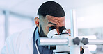 Microscope, man and scientist in laboratory with studying cell function for RNA development. Biotech, medical research and male geneticist with equipment for DNA vaccine, pharmaceutical or immunology
