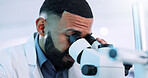 Microscope, man and scientist in laboratory with research on cell function for RNA development. Biotech, medical study and male geneticist with equipment for DNA vaccine, pharmaceutical or immunology