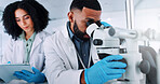 Forensic team, scientist and microscope with tablet for exam, test results or new discovery at lab. Man, woman or science employees with biotechnology for microscopic research or medical development