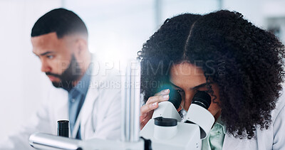 Buy stock photo Scientist, woman and microscope for medical research with lab partner, sample or vaccine development. Person, equipment and dna analysis for bacteria, virus or clinical trial for pharmaceutical study
