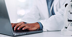 Hands, scientist and typing on laptop in lab of medical research, communication or experiment results. Person, tech or study information of investigation feedback, discovery update and vaccine report