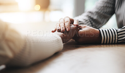 Buy stock photo Support, holding hands and people by desk with care, love and comfort with help for emotions. Unity, grief and friends with connection for compassion with trust, empathy and hope in crisis in home.