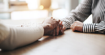 Buy stock photo Comfort, holding hands and people by desk with care, love and support with help for emotions. Unity, grief and friends with connection for compassion with trust, empathy and hope in crisis in home.