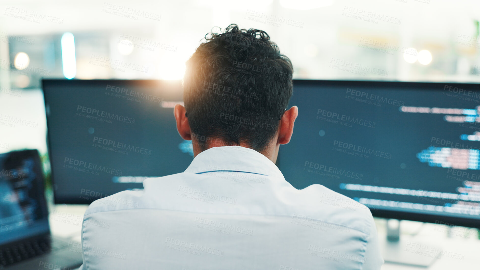 Buy stock photo Programmer, man and computer screen with reading in office for writing code, planning digital software and debugging. Back, programming and employee with data analytics for app development or testing