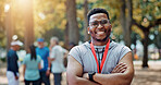 Portrait, athlete and man with arms crossed, nature and smile for win of competition and confident. Sports, runner and person with medal for race, champion and happy winner with prize for marathon