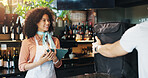Woman, tablet and bag for delivery at cafe with smile for courier service, food or sale at diner. Person, server and happy with ecommerce, online order or meal with small business owner at restaurant