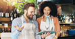 Small business, entrepreneur and people with tablet, cafe and review of order for stock and inventory. Discussion, woman and man with tech for sales, collaboration and colleagues with app in startup