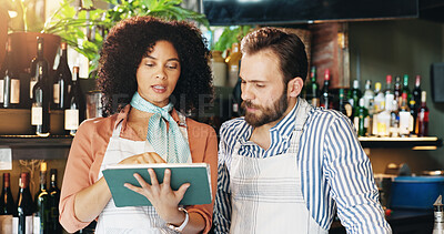 Buy stock photo Planning, entrepreneur and team with tablet, restaurant and review of order for inventory and people. Hospitality, woman and man with tech for pub sales, online and colleagues with app for discussion