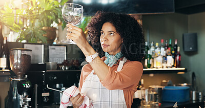 Buy stock photo Woman, bartender and cleaning glass with cloth for hygiene, dust or service for drinks at restaurant. Person, waiter and check for dirt with smile, shine and career with inspection at small business