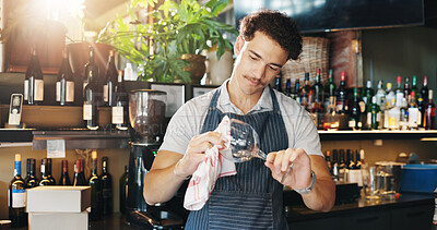 Buy stock photo Waiter, man and cleaning wine glass with cloth for hygiene, dust and service for drinks at restaurant. Person, bartender and wipe for shine with check, germs and inspection for dirt at small business