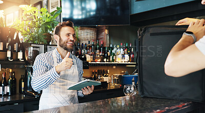 Buy stock photo Man, store and thumbs up for delivery at restaurant with smile for courier service, food or sale at diner. People, server or happy waiter with tablet, order or bag in meal with small business owner