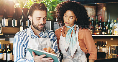 Buy stock photo Small business, online and colleagues with tablet, bar and inventory of stock for wine and collaboration. Discussion, woman and man with tech for sales, alcohol and ideas for promotion of restaurant