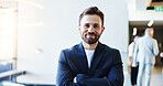 Happy, confident and portrait of businessman in lobby for corporate finance conference. Crossed arms, pride and face of male financial manager from London at seminar for investment proposal. 