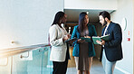 Business people, tablet and meeting in lobby for planning, agenda update or campaign feedback with notes. Company team, tech and discussion in office for project management, review or problem solving