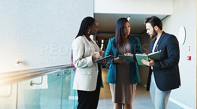 Buy stock photo Business people, tablet and meeting in lobby for planning, agenda update or campaign feedback with notes. Company team, tech and discussion in office for project management, review or problem solving