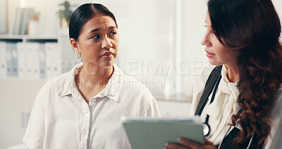 Buy stock photo Doctor, women and consultation with tablet, conversation and explain treatment for illness. People, medical or professional with client, tech or app with healthcare, diagnosis or advice for insurance